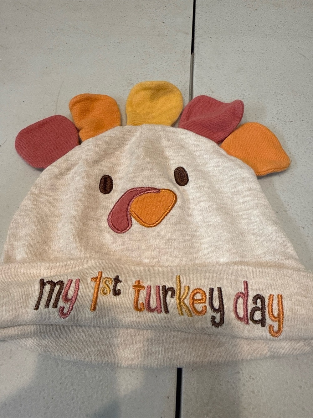 My first Turkey day Baby Hat with with sewn on feathers festive and cute